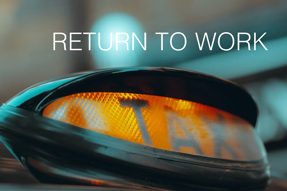 Taxi sign glowing amber beneath the text "RETURN TO WORK," creating a vibrant, urban feel. Background blurred in cool tones.