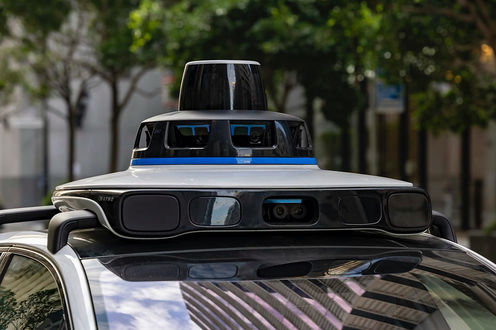 Autonomous car roof sensor array with cameras and lidar on a street, blurred trees and buildings in the background