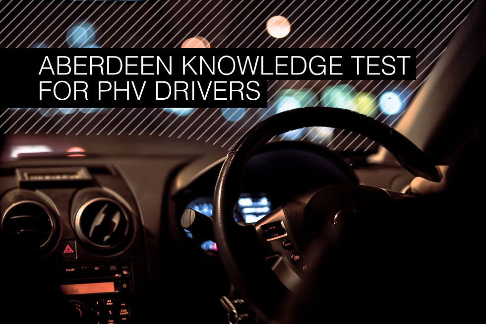 Car interior at night, dashboard and steering wheel in focus. Text overlay: Aberdeen Knowledge Test for PHV Drivers. Blurred lights outside.