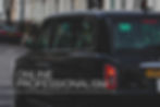 Black London taxi on a city street with red taillights; large text reads ONLINE PROFESSIONALISM.