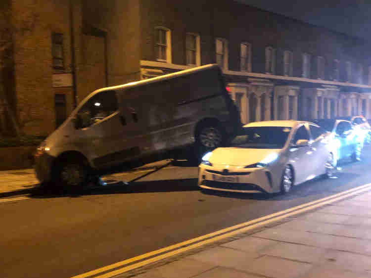 Crash leaves van ON TOP of minicab causing delays in East London