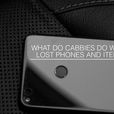 What should a taxi driver do with a phone left on the back seat of their cab?