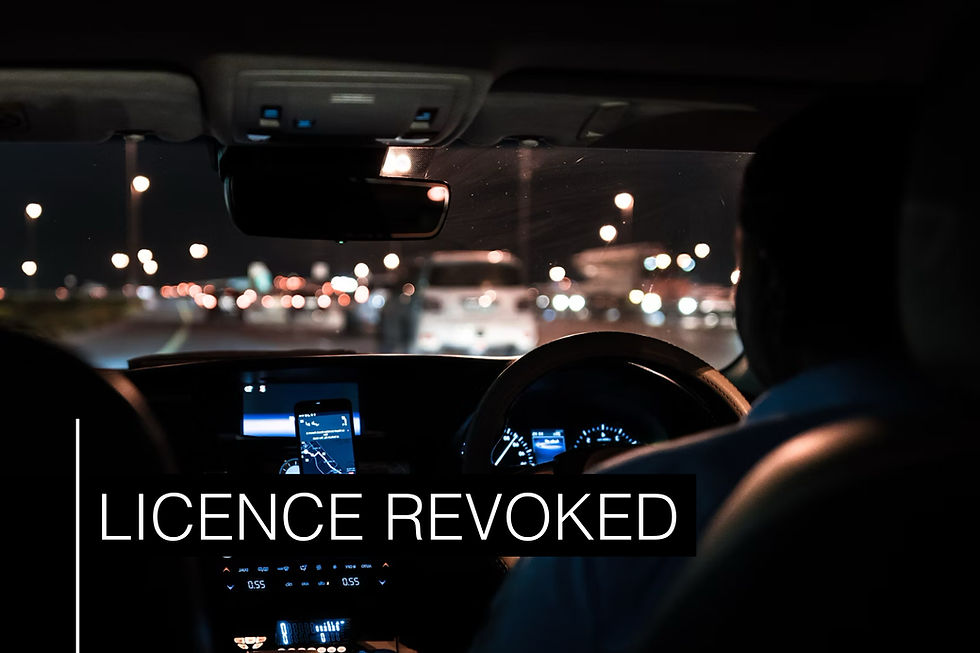 View from inside a car driving at night with blurred city lights. Dashboard displays navigation. Text overlay reads "LICENCE REVOKED."