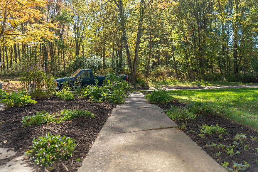 Landscaping with mulch beds and walkway