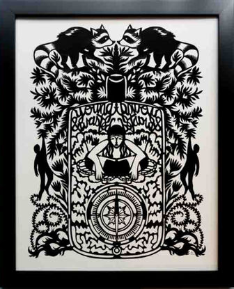 An intricate papercutting art piece with raccoons and a woman