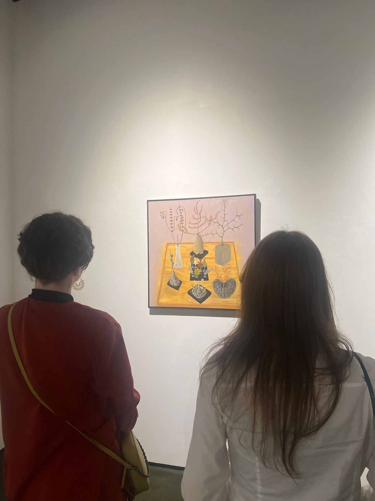 Co-founder Emma Sonnier and Co-Founder Lex R. Thomas view a ULL Visual Arts student's studio space