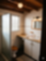 Modern bathroom with wooden ceiling and white vanity