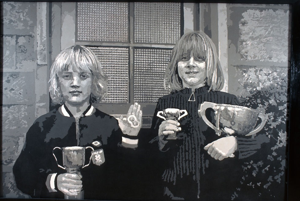 "Trophies: James wearing his prized World Cup 1974 track suit) and Clare standing outside Spring Gar