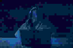 faceless person at computer