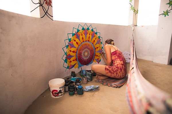Falina working on Sunset Over Amazon Mur