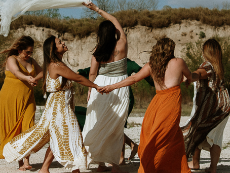 Women Dancing on the Beach