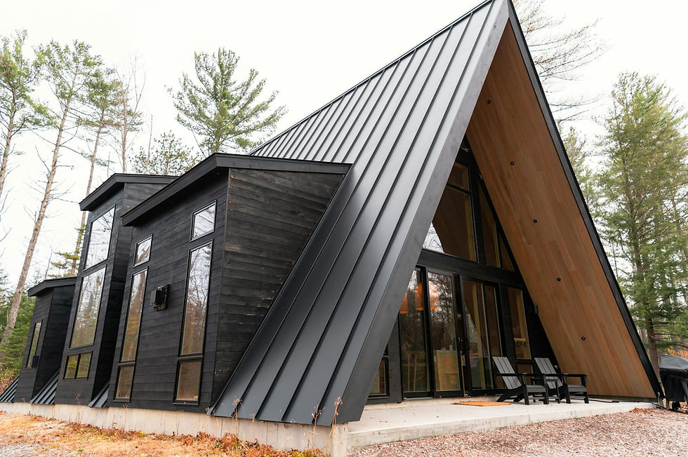 free-photo-of-modern-a-frame-cabin-in-forest-setting.jpeg