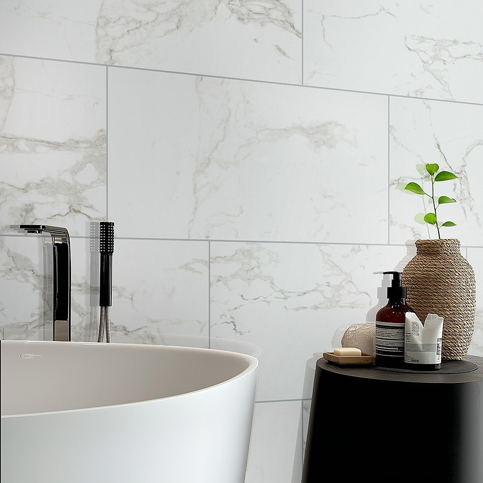 Close view of white marble-look porcelain wall tile with soft gray veining behind a freestanding tub and a black side table