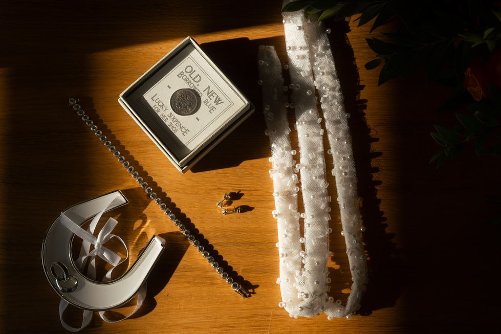 Decorative items on a wooden surface with shadows.