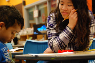 Pictured: Taylor Wong, UW College of Education student. Teaching 1st grade literacy.