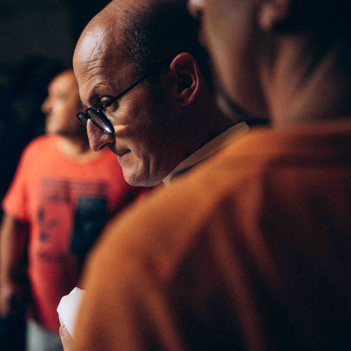 Candid shot of men during a religious gathering.
