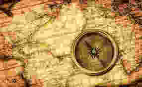 Sepia world map with compass