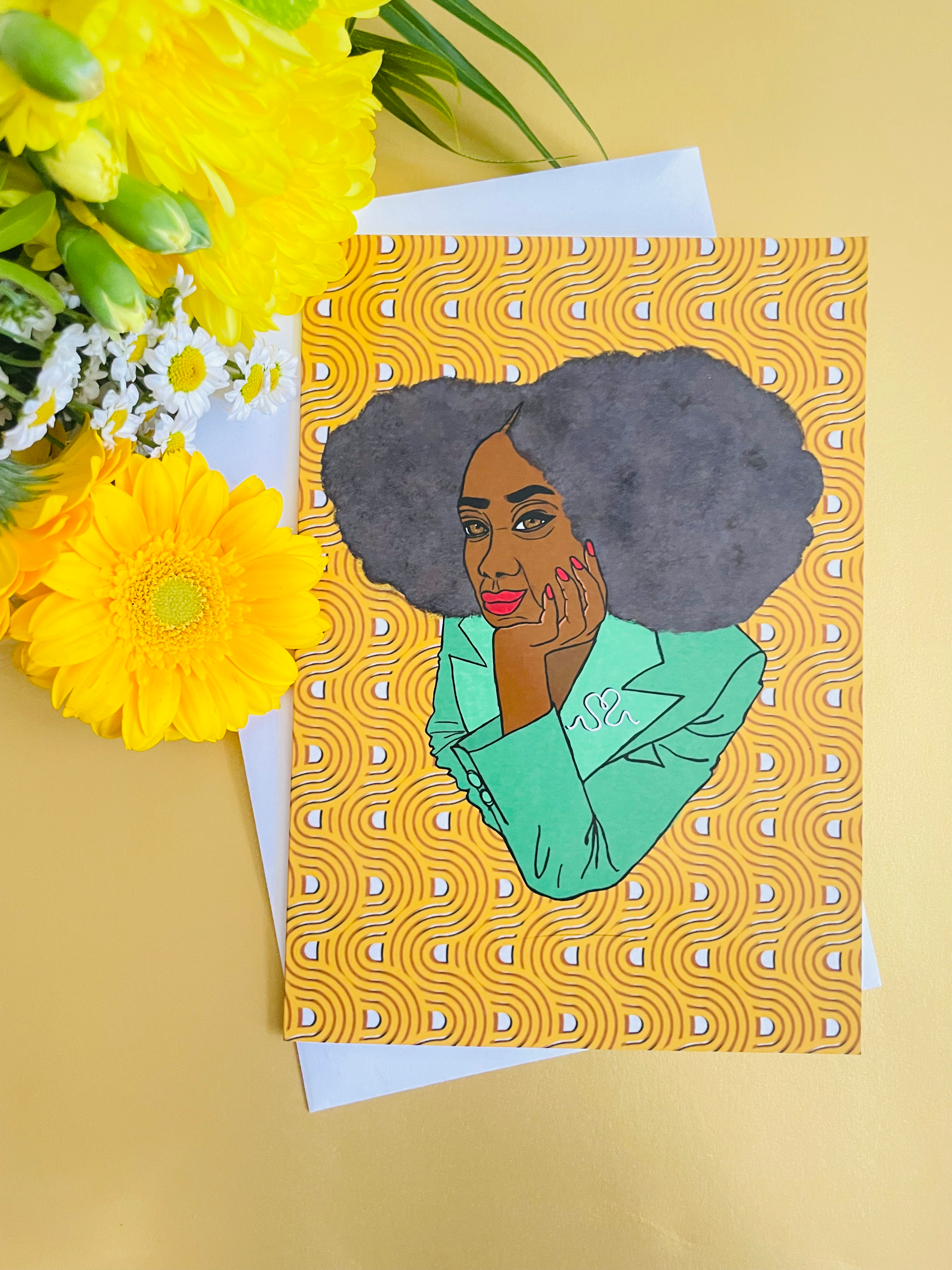 a woman of African heritage with an afro, wearing an emerald green suit.