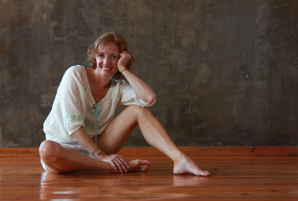 Stephanie sitting on the studio floor
