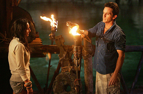 Jeff Probst of tv's survivor puts out a contestants torch