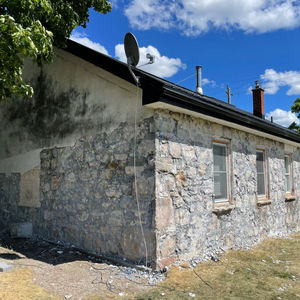 Stone house before repointing