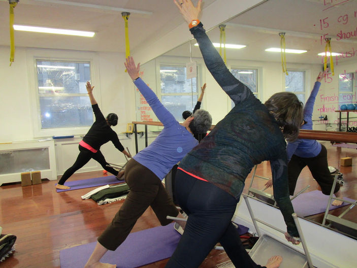 YogaNorma Revolved Triangle with Chair In-person Class Upper East Side