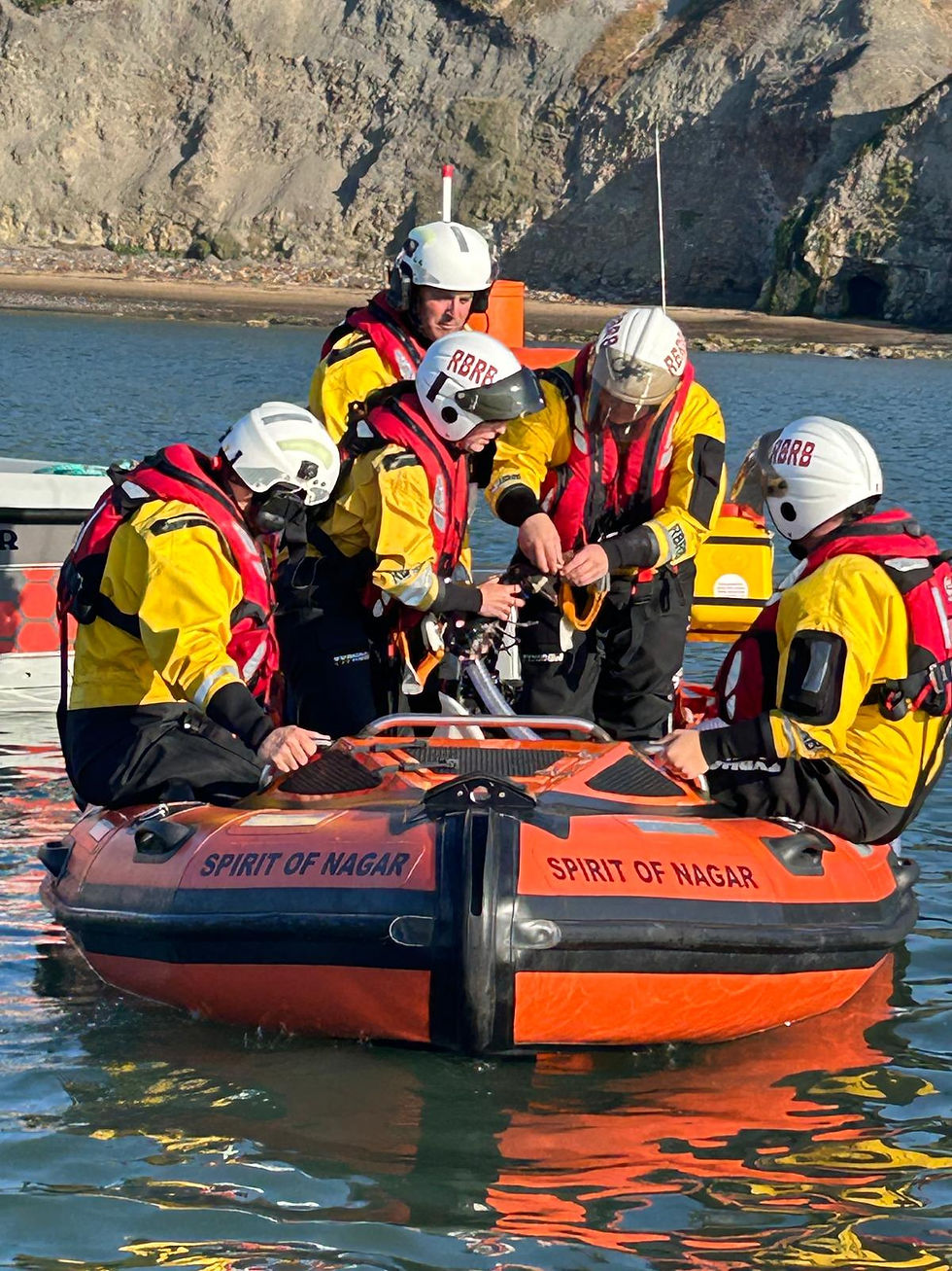 Eye-level view of Runswick Bay Rescue Boat preparing baby lobsters for release