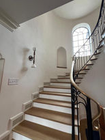 Curved staircase with Venetian plaster in Hudson Valley.