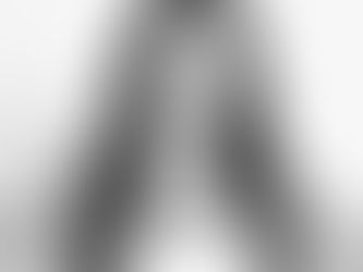 FutureFLEX trainer Sydney with brown hair, white top, hands on hips, smiling at the camera