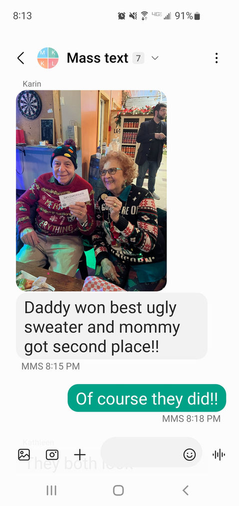 Text message about winning an ugly sweater contest.