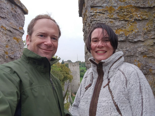 Jaime with husband standing in front of historic site.
