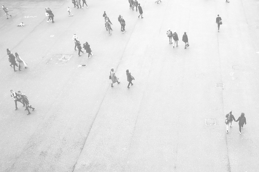 People walking in an urban square.