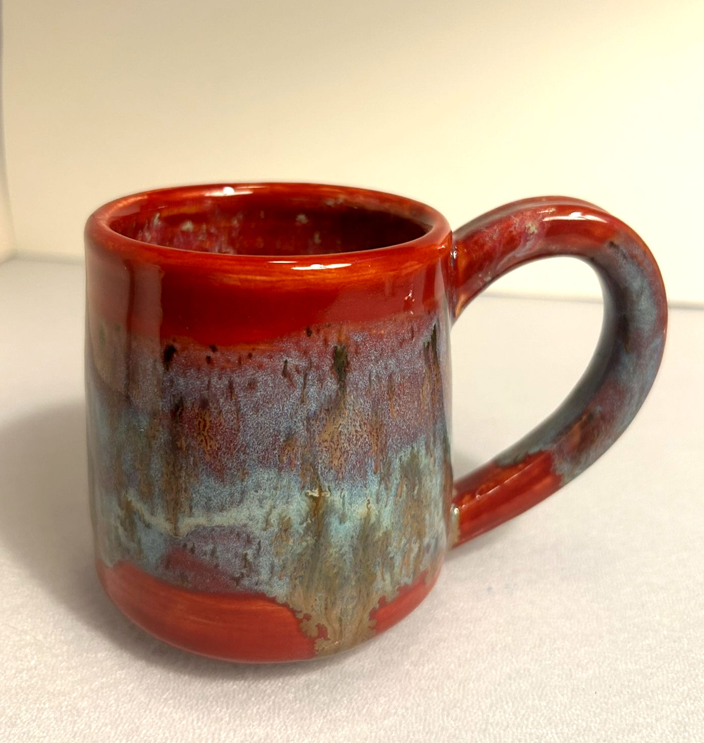 Red with blue drip mug