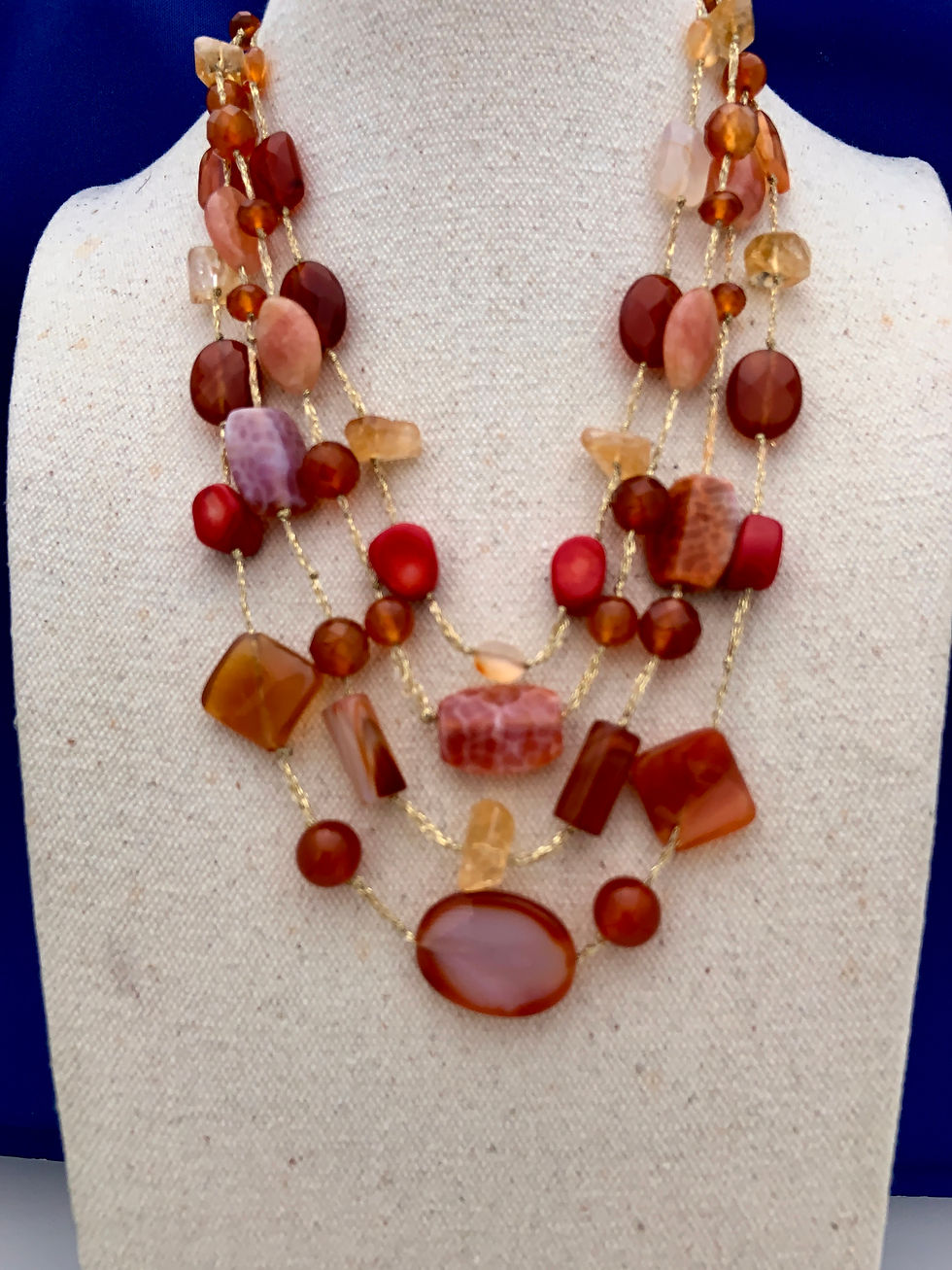 Coral Agate Citrine on brocade cord.