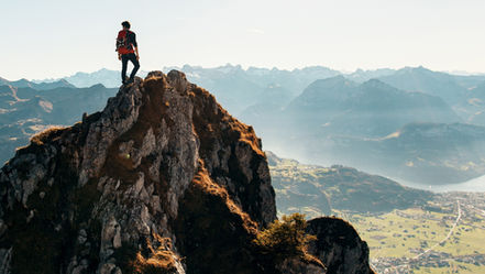 Man standing on top of a mountain.