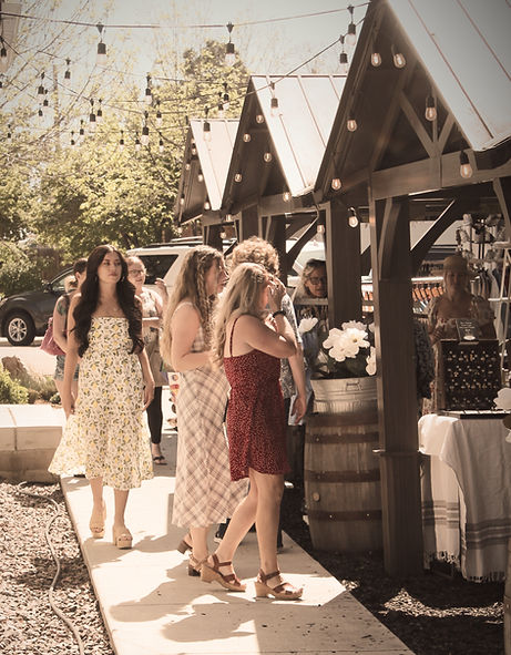 Shoppers browsing curated outdoor market at JJ District