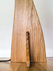 close up of wood floor lamp  as part of hand made nature inspired furniture