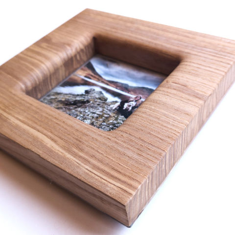 Wooden picture frame with landscape photo