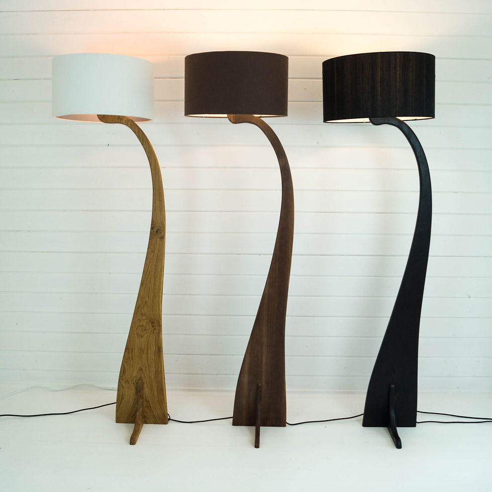 Thumbnail: Three curved wooden floor lamps white, brown, and black