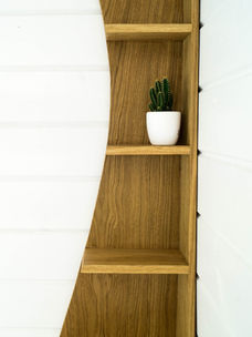 closeup of wood shelf unit as part of hand made nature inspired furniture