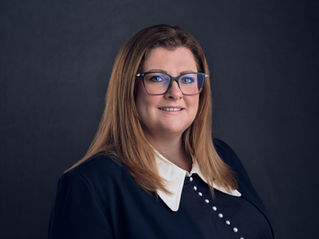 Modern studio headshot of female business executive