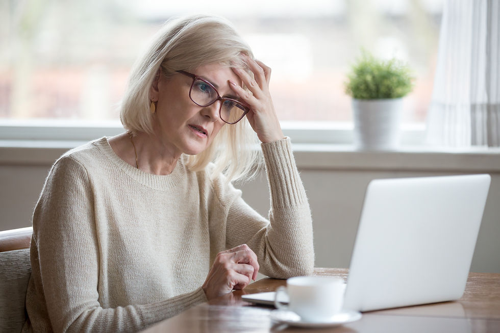 Mature woman thoughtfully working through brain fog due to chronic stress.