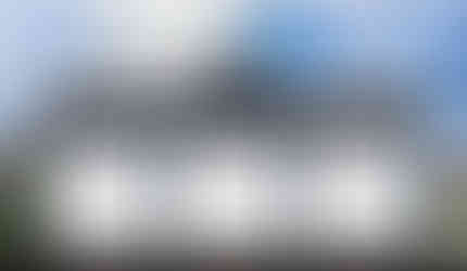 Front picture of Sun Peaks A, a three-car, drive-through garage built in the traditional style. #TraditionalStyle #GarageDesign #FrontElevation #3DRendering