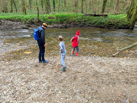 Father and autistic kids playing in River Avon, Salcombe, Devon