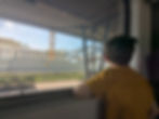 An autistic child looking quietly out the window at Riga Station - on board the train from Riga to Jurmala, Latvia