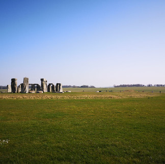 View of Stonehenge stone circle from across the fields as you walk from the visitor centre