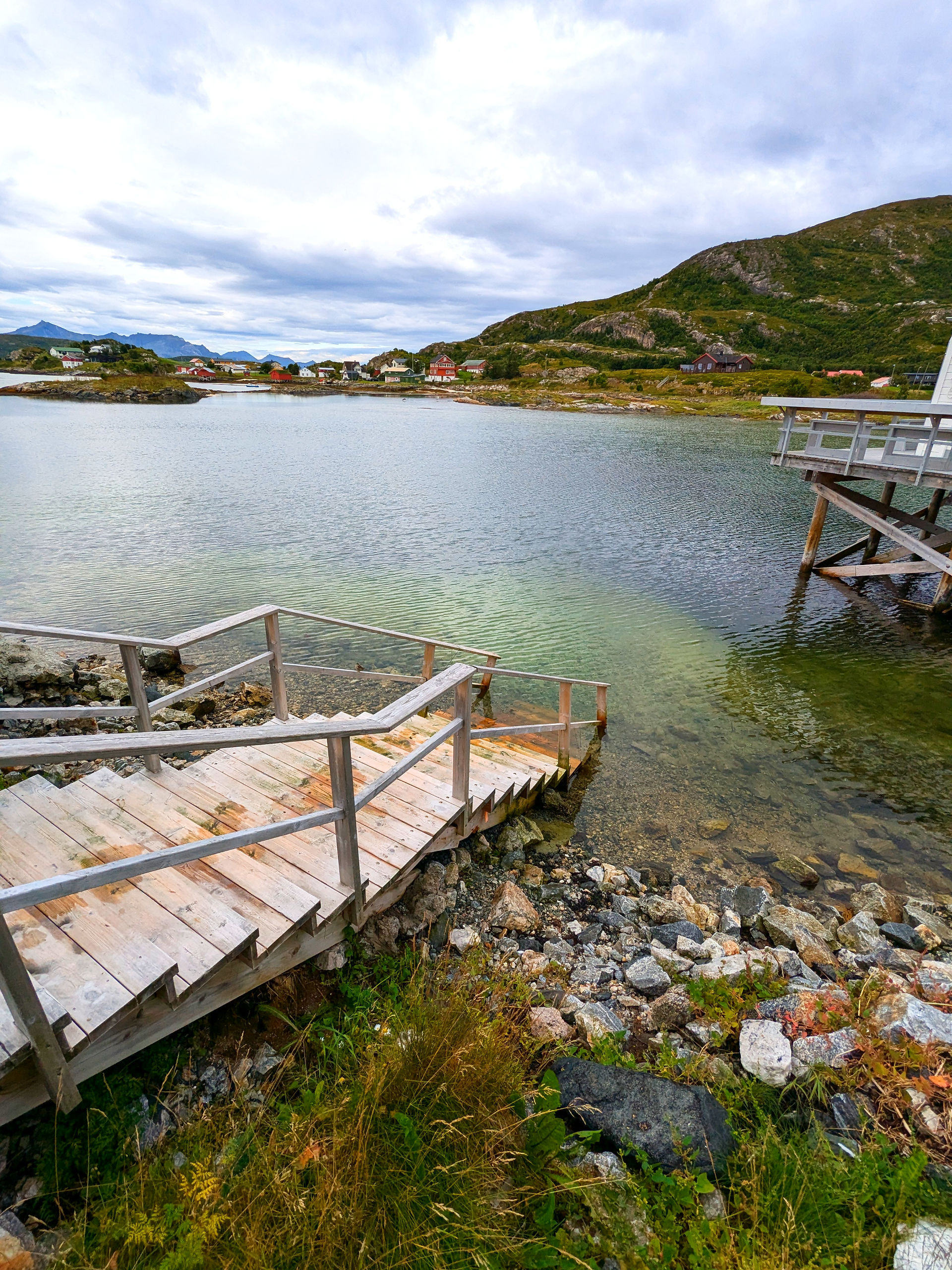 Steps leading from a badehus sauna down to a sea lagoon