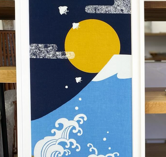 Oriental Fabric Travel Momento that has been framed with white matboard and white frame