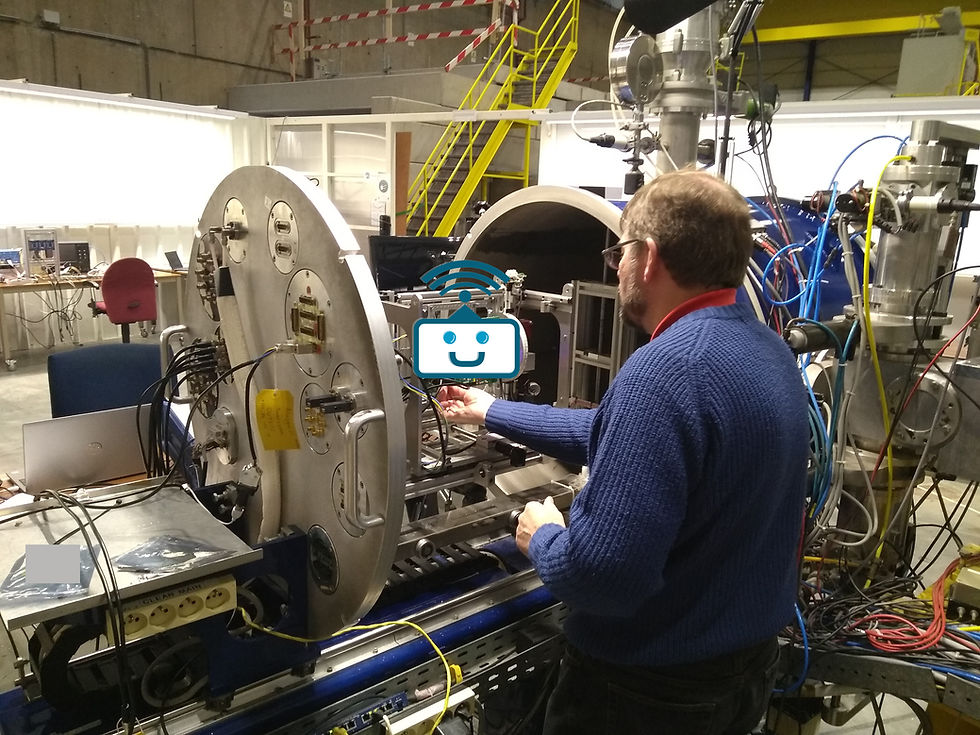 Jonathan Riley preparing radiation effects testing equipment at a cyclotron facility for space environment simulation work.