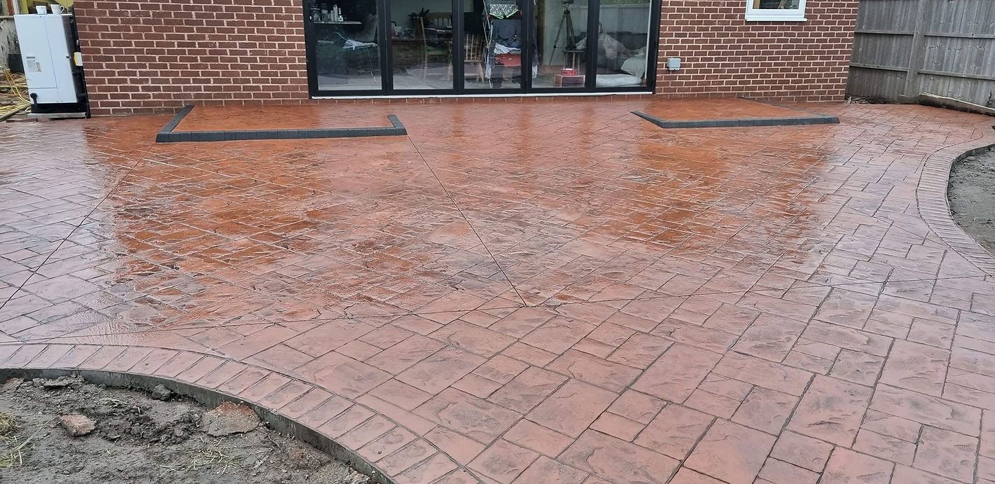 Imprinted concrete patio and pathway around the garden